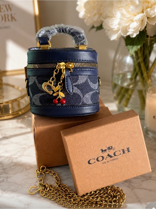 Coach Handbags - Coach Navy Signature Canvas Mini Vanity Bag with Cherry Charm